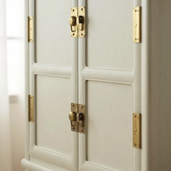 Illustrative: late Qing huanghuali compound cabinet with brass baitong hardware and original mortise-and-tenon joinery
