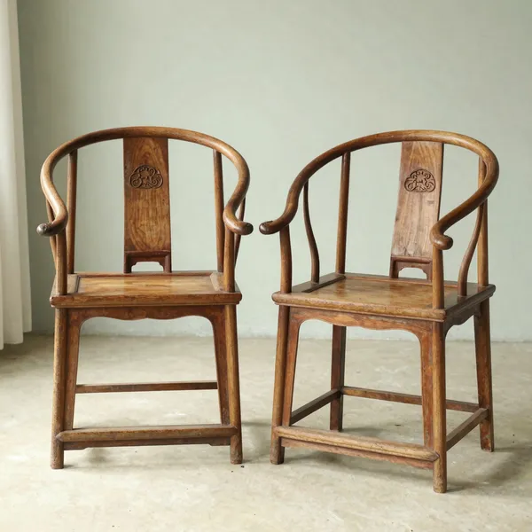 Illustrative: pair of Chinese hardwood yokeback chairs, later Qing, with honest wear and intact joints