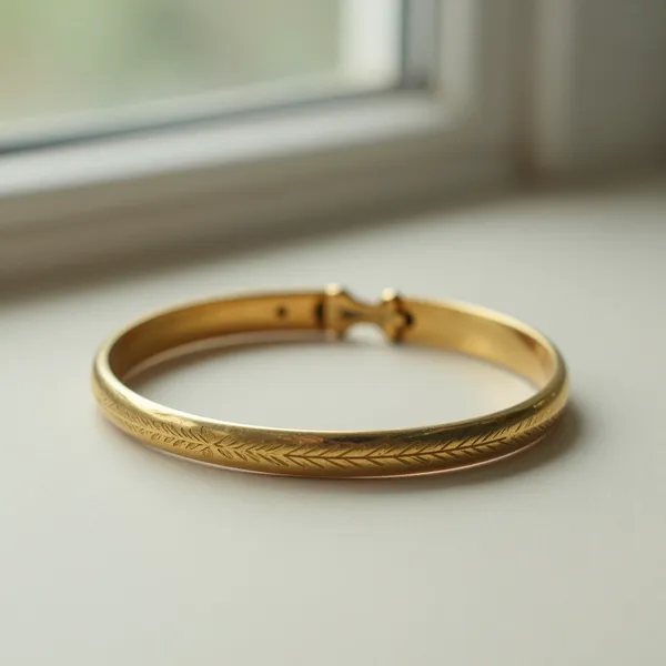 Illustrative: Victorian 15ct gold hinged bangle with engraved decoration, English, circa 1880