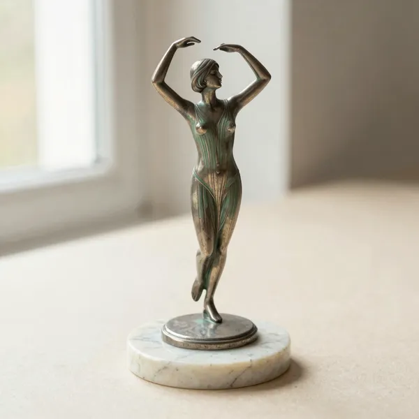 Illustrative: Art Deco spelter dancer on a marble base, 1920s to 1930s, unsigned